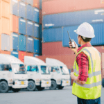 Foreman at container port with trucks