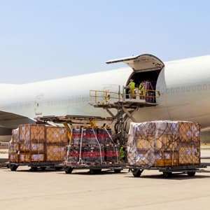 Airline ULDs being loaded onto airplane