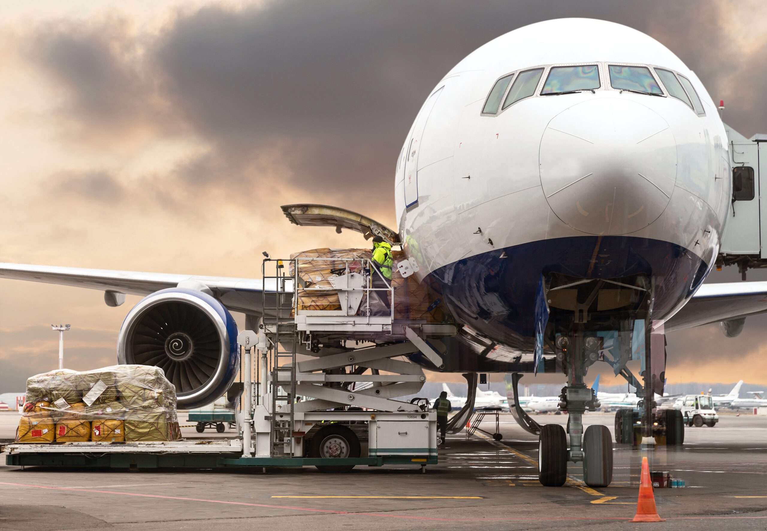 freight on trucks being transported to aircrafts